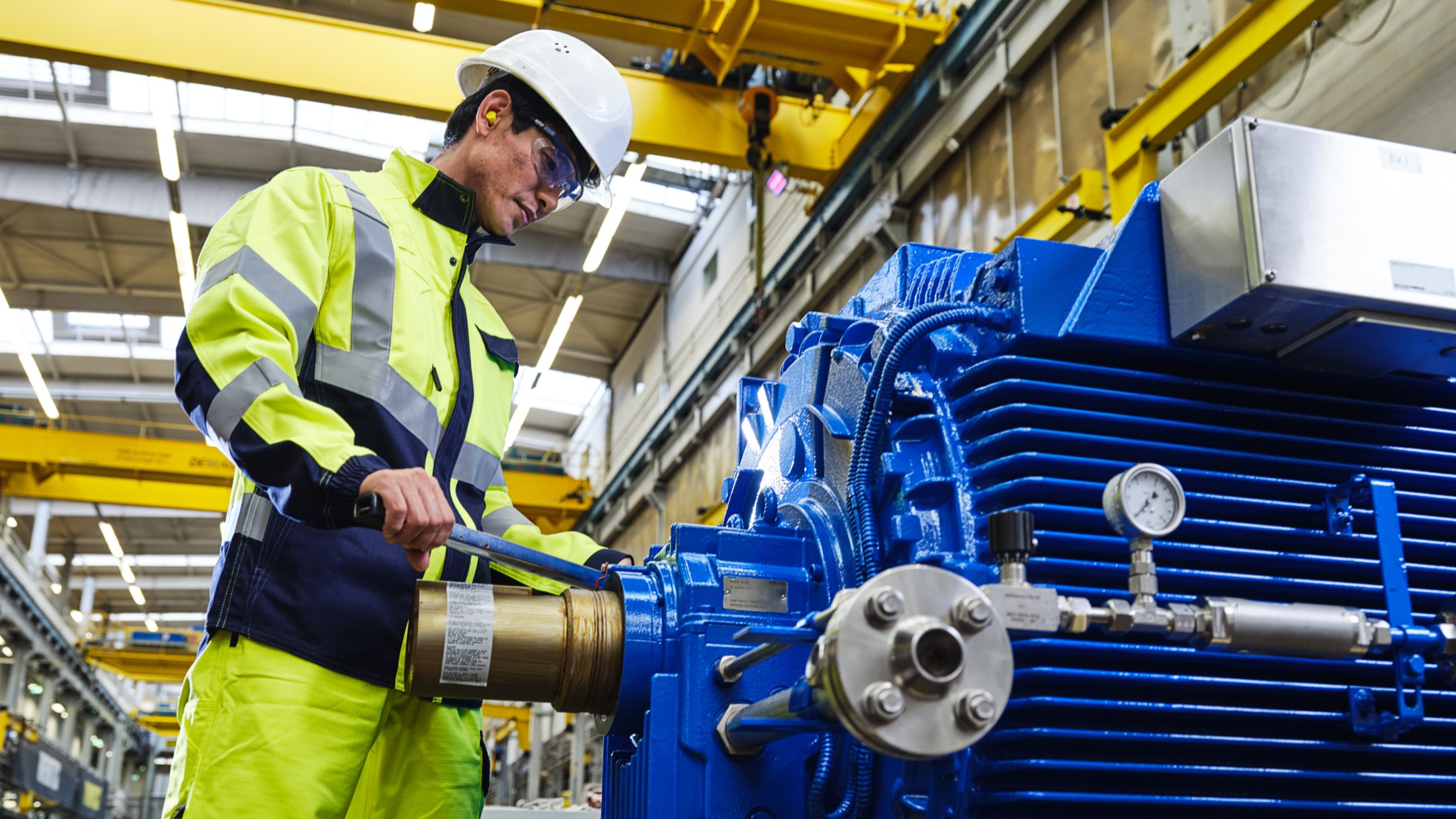 Factory worker and motor Factory worker and motor