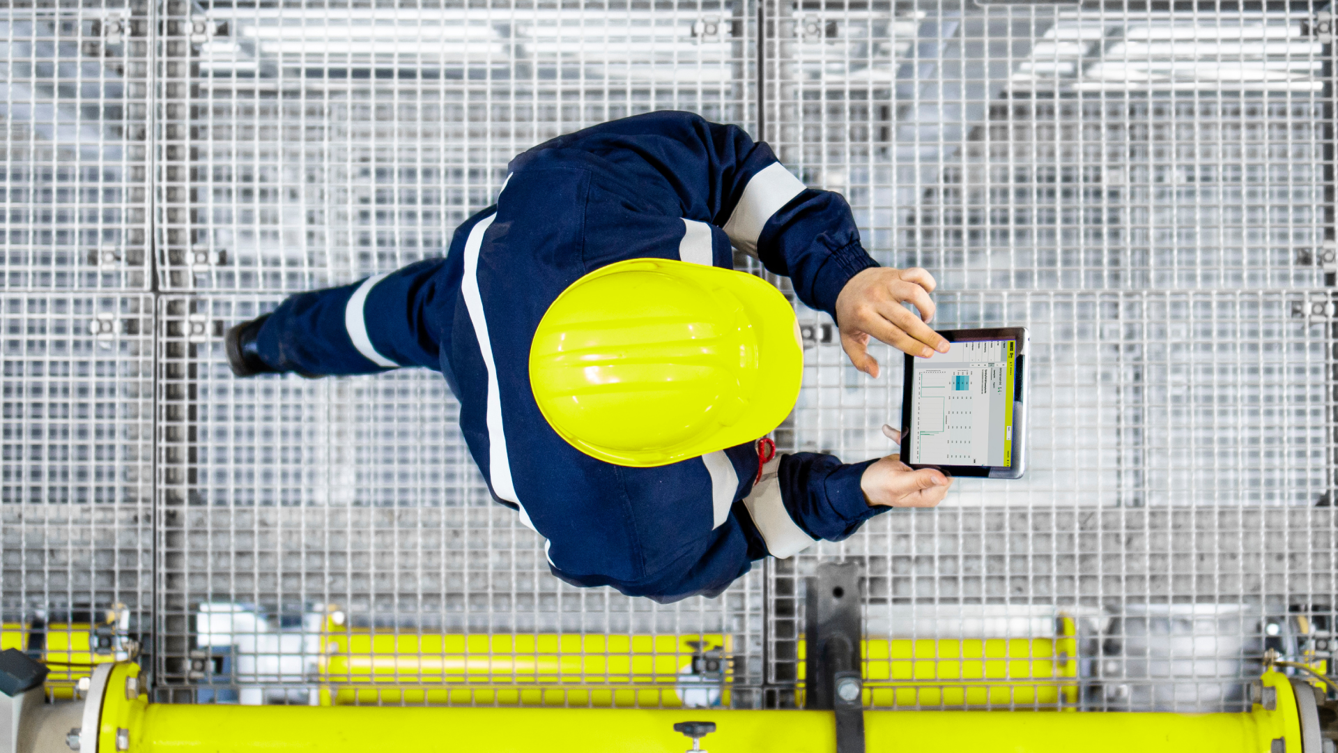 plant worker with a tablet to monitor plant worker with a tablet to monitor